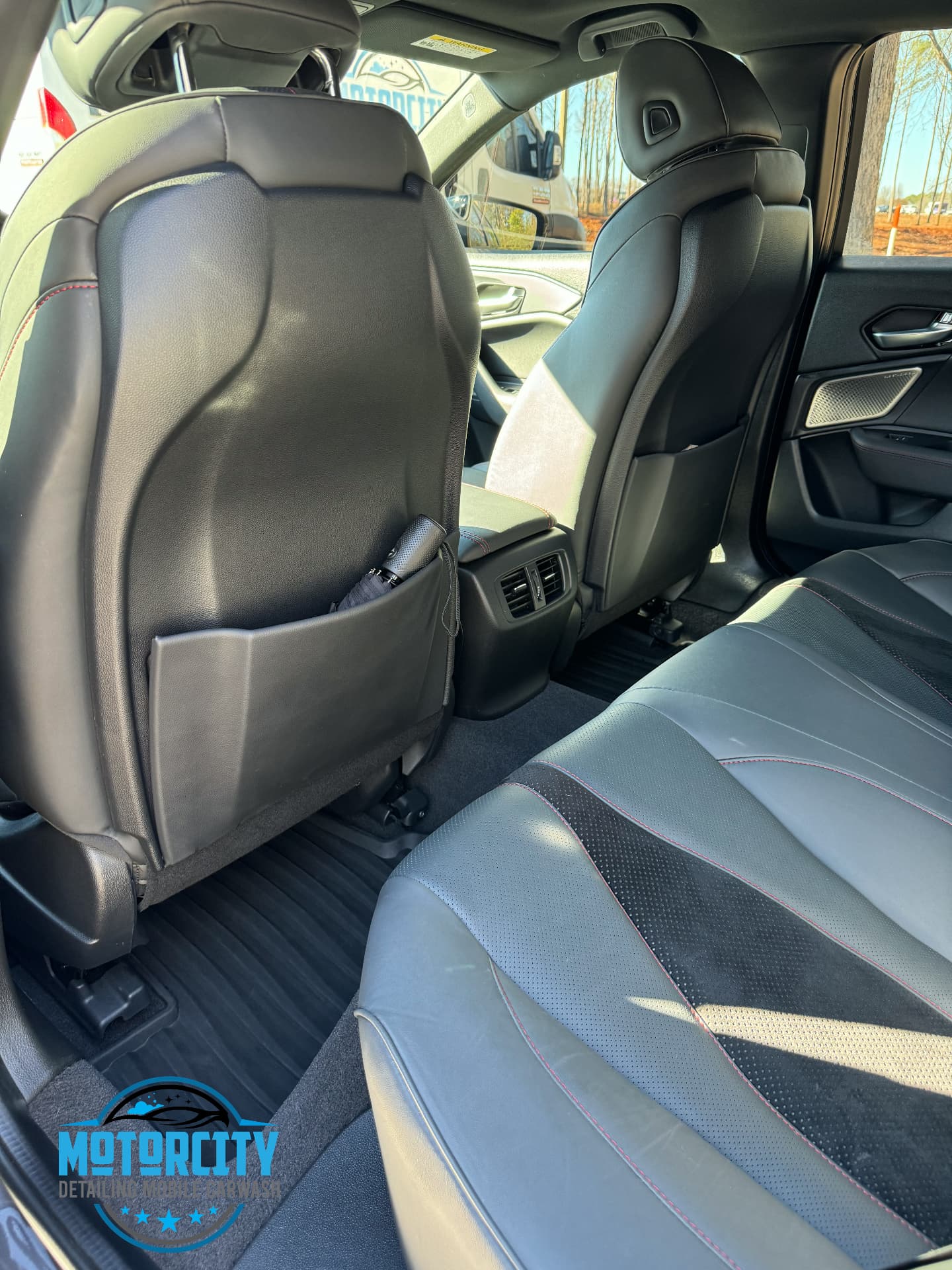 Rear seat backs and carpet cleaned during a mini interior detail