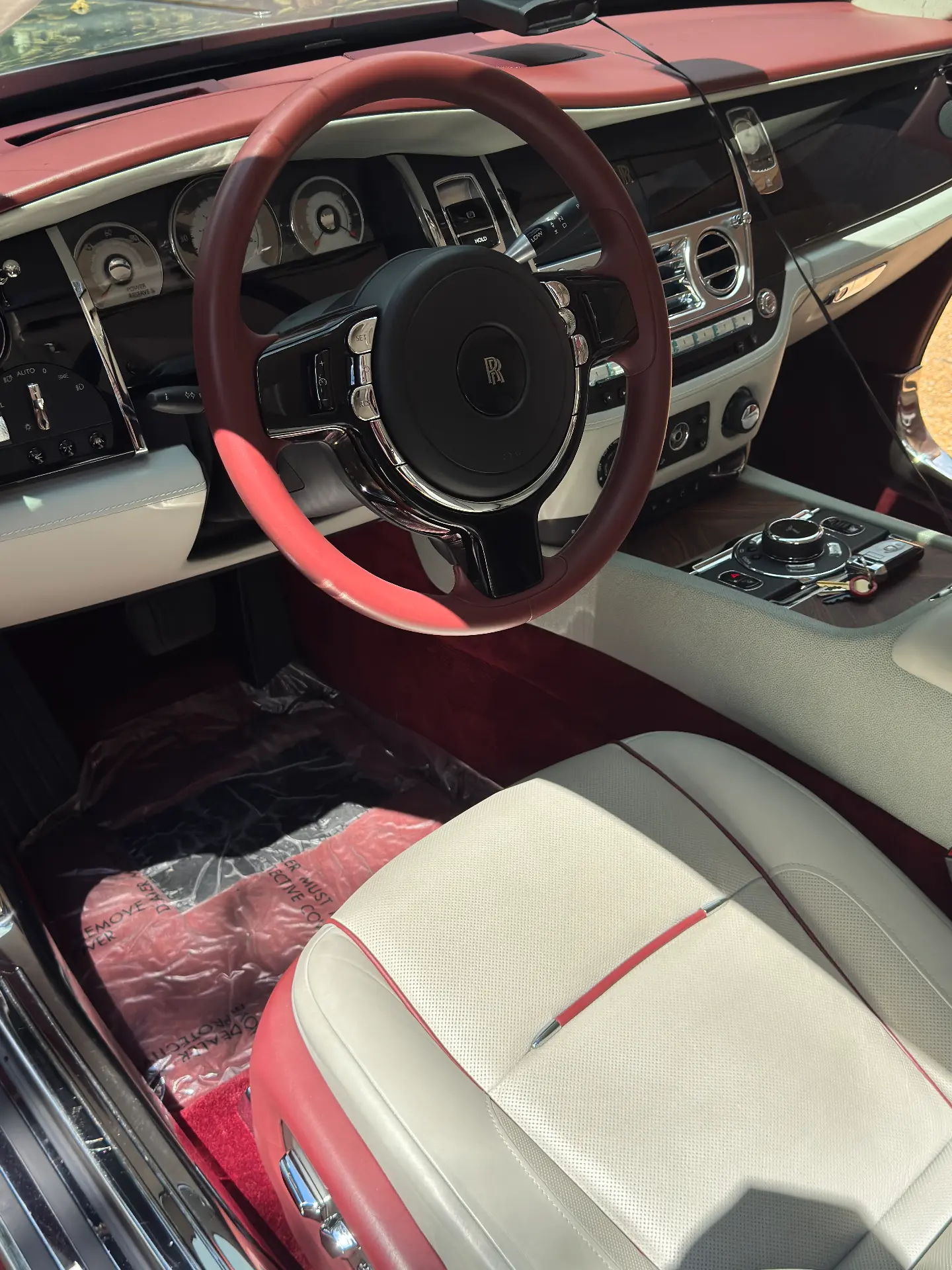 Interior detailing on a Rolls-Royce Wraith cockpit with cream leather