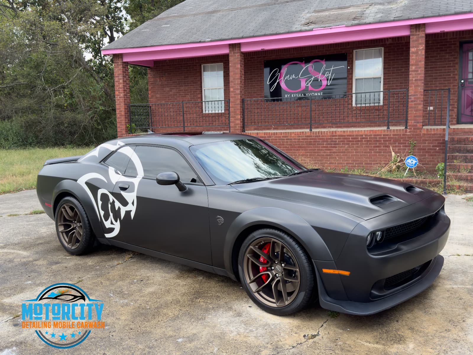 Satin black Dodge Challenger SRT Hellcat with bronze wheels after a full detail