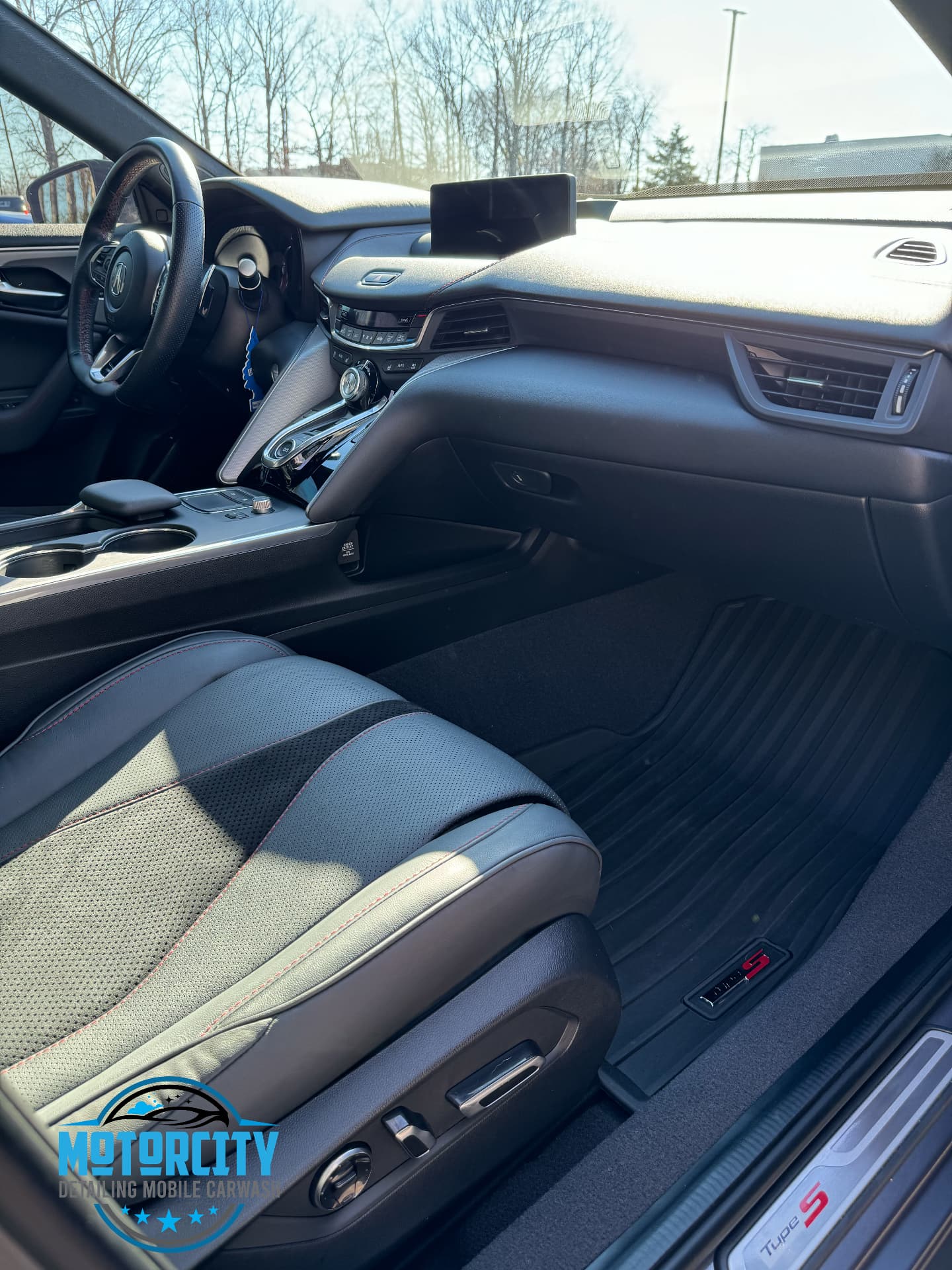 Passenger view of a cleaned dash, vents and front seats after an interior refresh