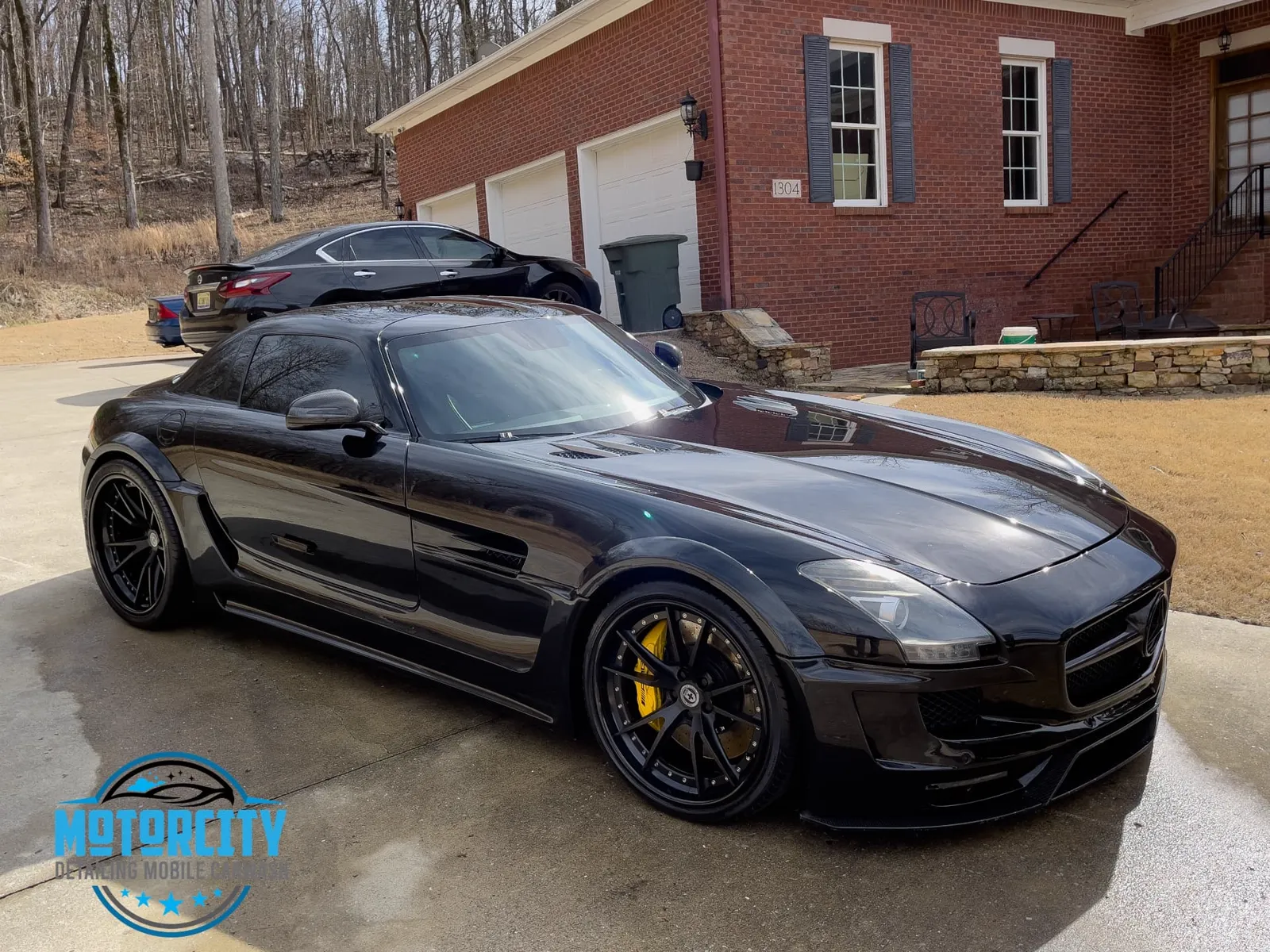 Polished paint on a black Mercedes-Benz SLS AMG after paint correction