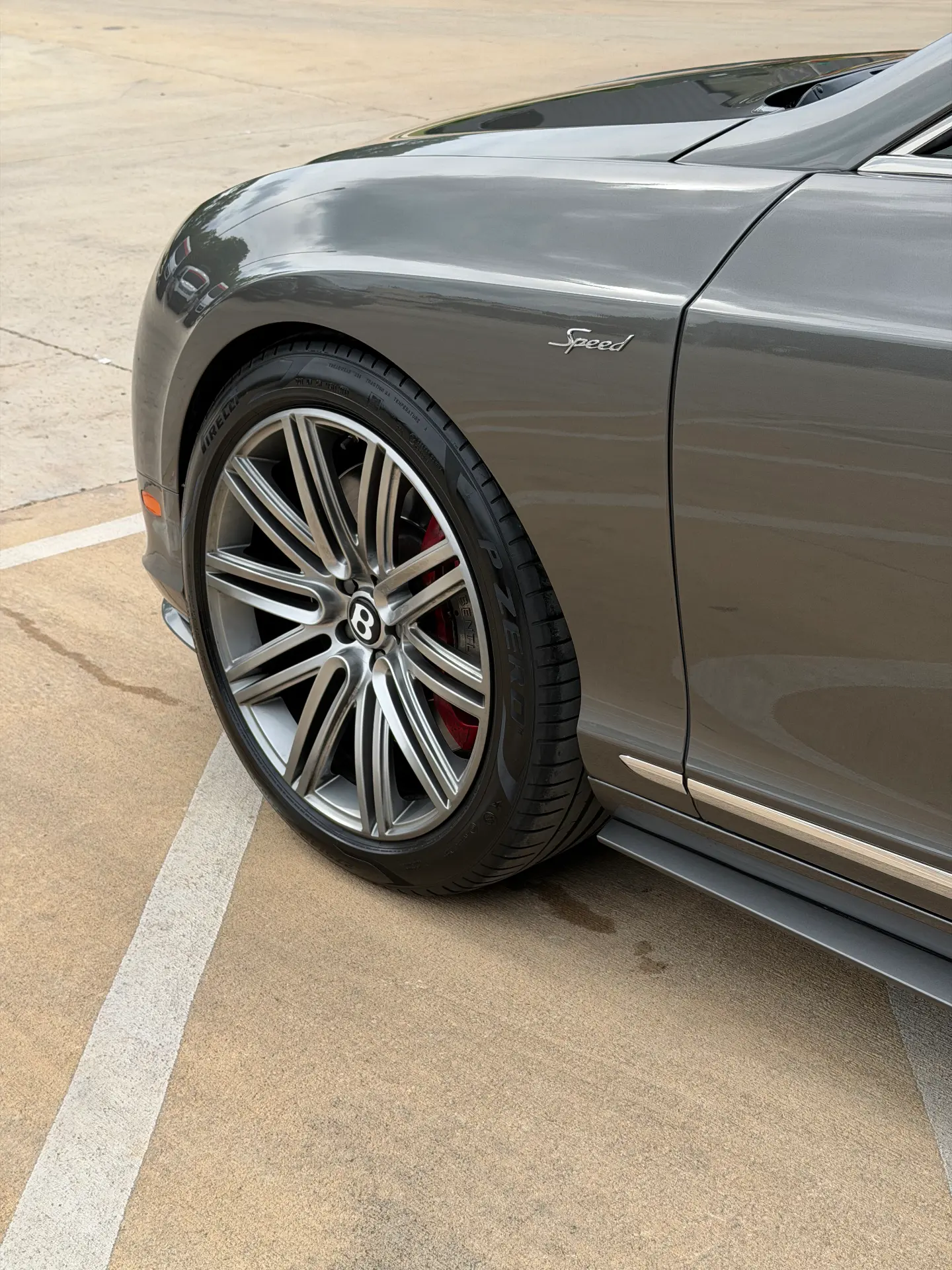 Detailed wheel, tire and ceramic coated fender on a Bentley